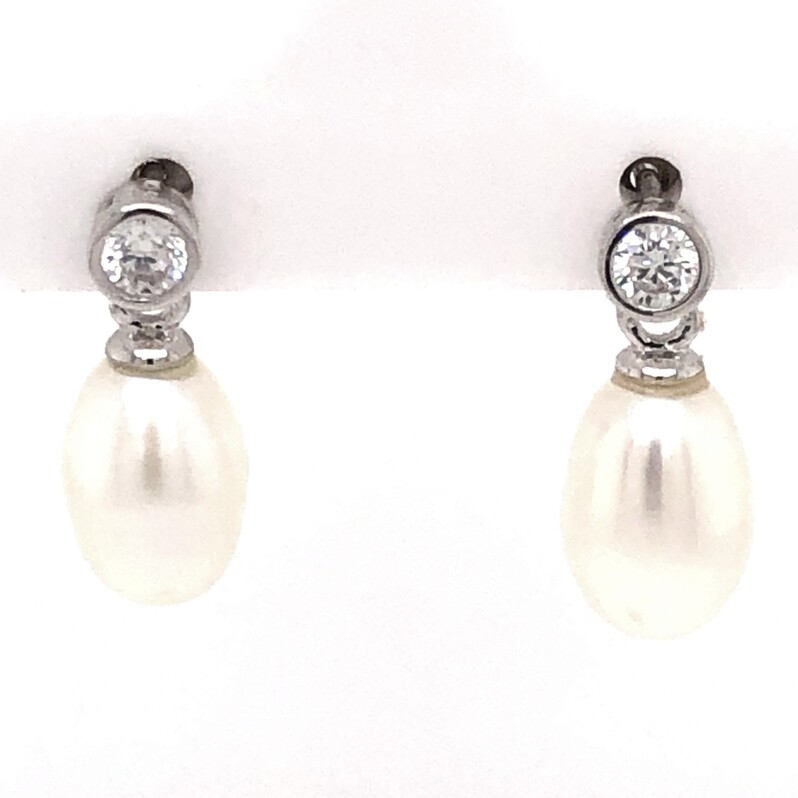SS Earrings With 2 Freshwater pearls set below two CZ s.