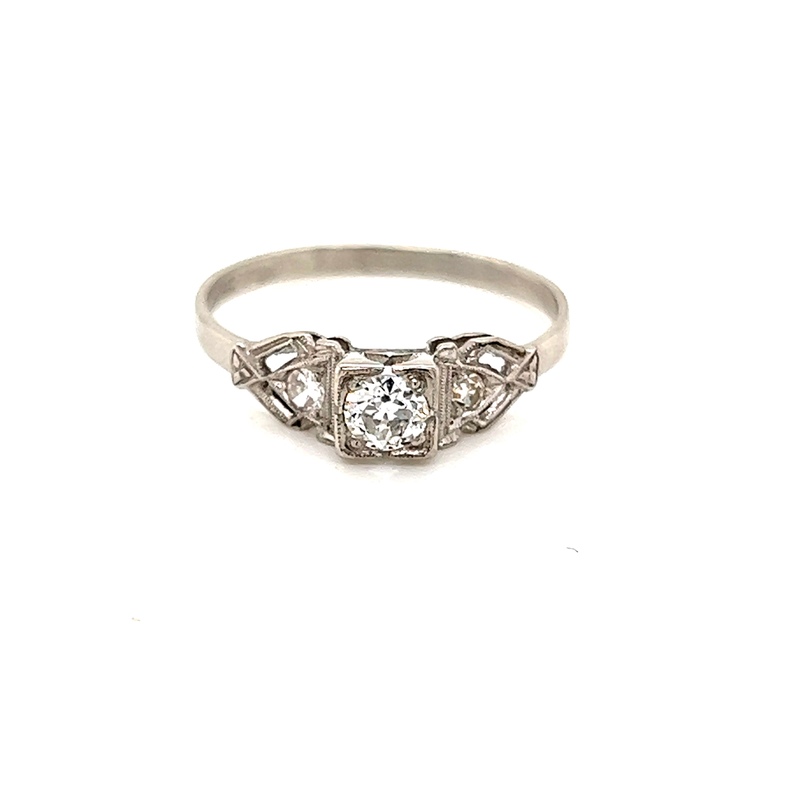 Ladies Platinum Estate filigree engagement ring with one Old European cut center diamond  0.25 carat  G color  SI2 clarity.  Ring also has two single cut diamond accent stones totaling 0.08 carat  G color  VS in clarity.