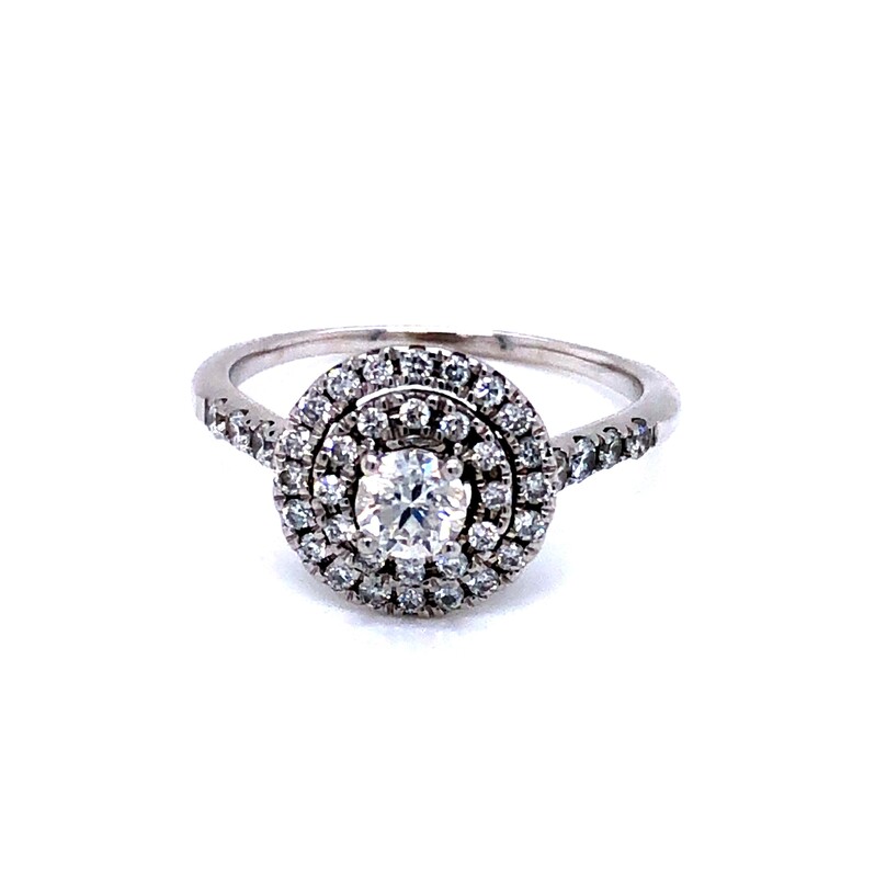 Lady s 14 karat white gold engagement ring with one 0.33 carat round brilliiant center diamond G color  I2 in clarity.  There are 42 round brilliant accent stones in the double halo and down the sides of the ring totaling 0.43 carat  G color  VS in clarit