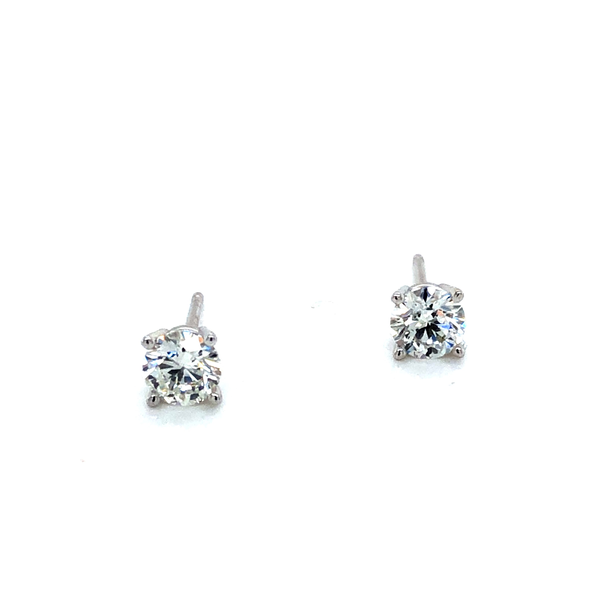 Lady s White 14 Karat Earrings With 2=0.70Tw Round Brilliant F SI Diamonds