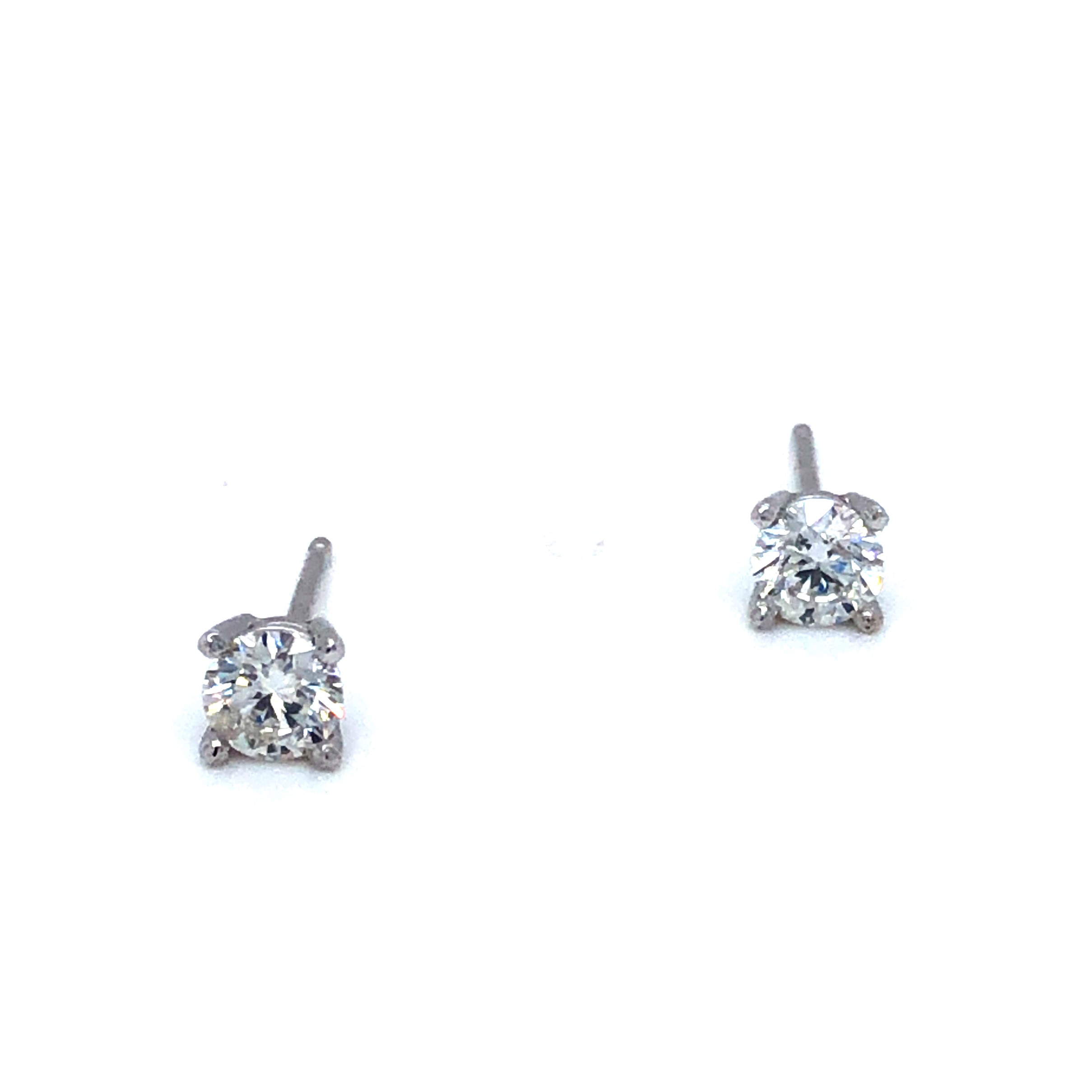Lady s White 14 Karat Earrings With 2=0.50Tw Round Brilliant F I1 Diamonds