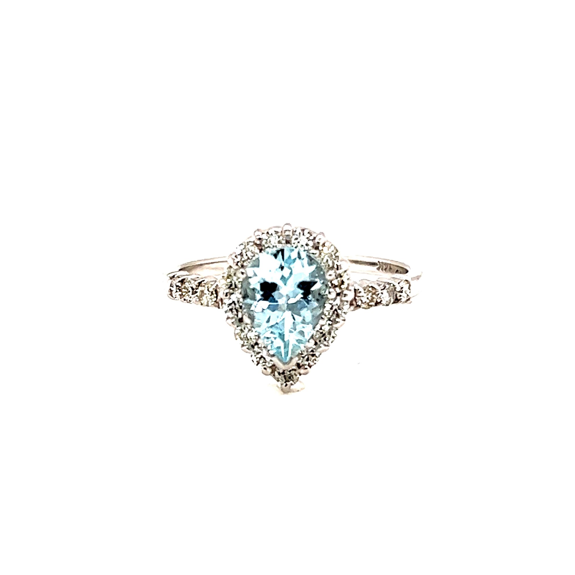 14 Karat White Gold Ring With 19=0.45TW Round Brilliant G SI Diamonds And One 0.90CT Pear Aqua