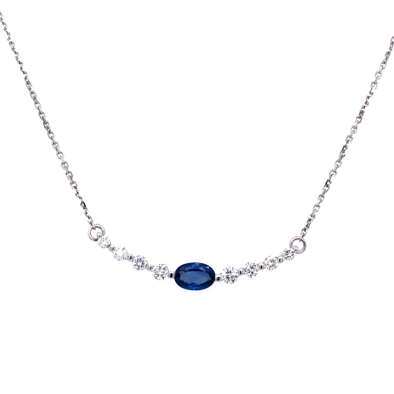 18 Karat White Gold  Necklace With 8=0.30TW Round Brilliant G SI Diamonds And One 0.60CT Oval Sapphire Center