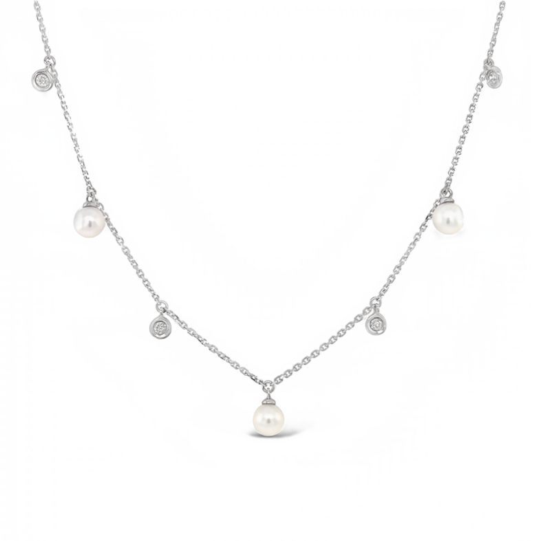 White 14 Karat Station Necklace with 4=0.10tw Round Brilliant G I Diamonds and   5= Round Pearls
