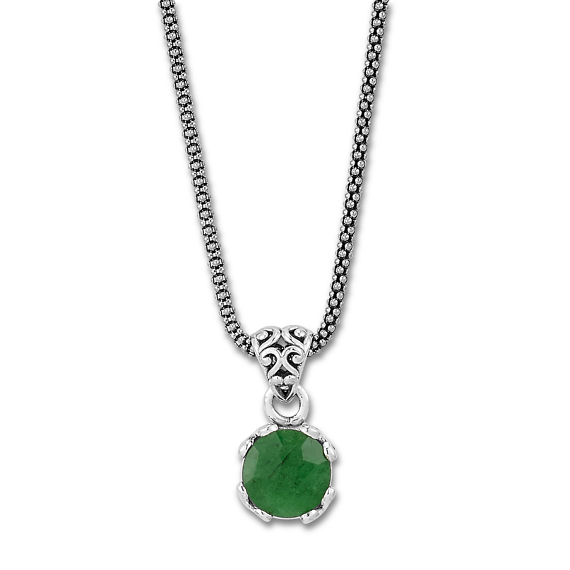 Ladies sterling pendant set with one Emerald on a popcorn link chain.