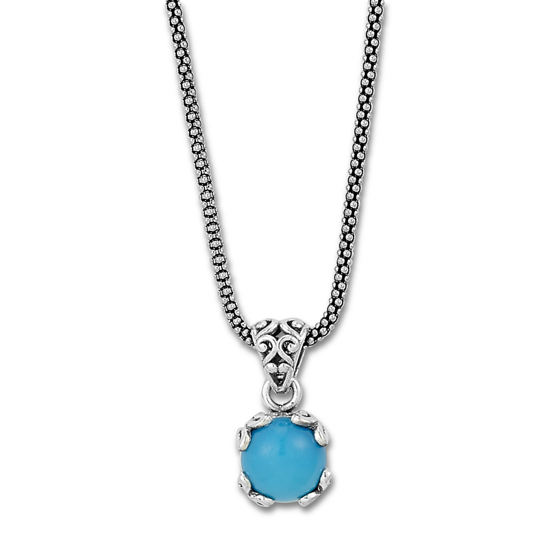 Sterling silver round sleeping beauty turquoise pendant on a popcorn chain.