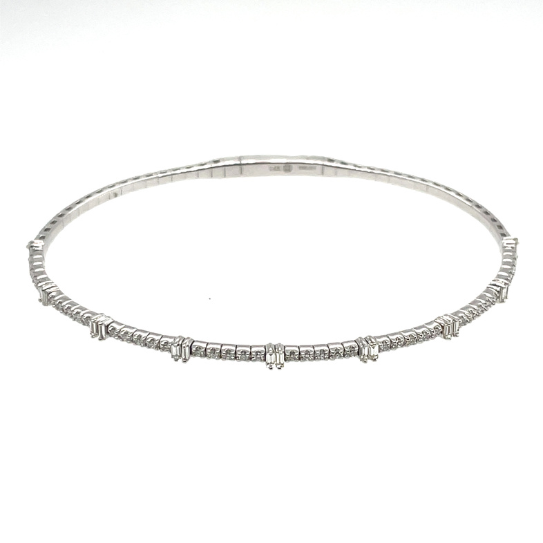 .49CTW DIAMOND FLEX BANGLE WITH 9 BAGUETTE STATIONS CONTAINING: 18 BAGUETTE DIAMONDS; .257CTW; + 40 ROUND DIAMONDS; .235CTW; I; SI1; 14KW