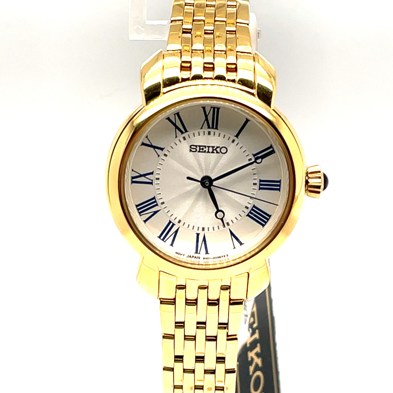 SEIKO 29.2MM ROUND WHITE DIAL WITH ROMAN NUMERAL MARKERS; LINK BRACELET; GOLD TONE
