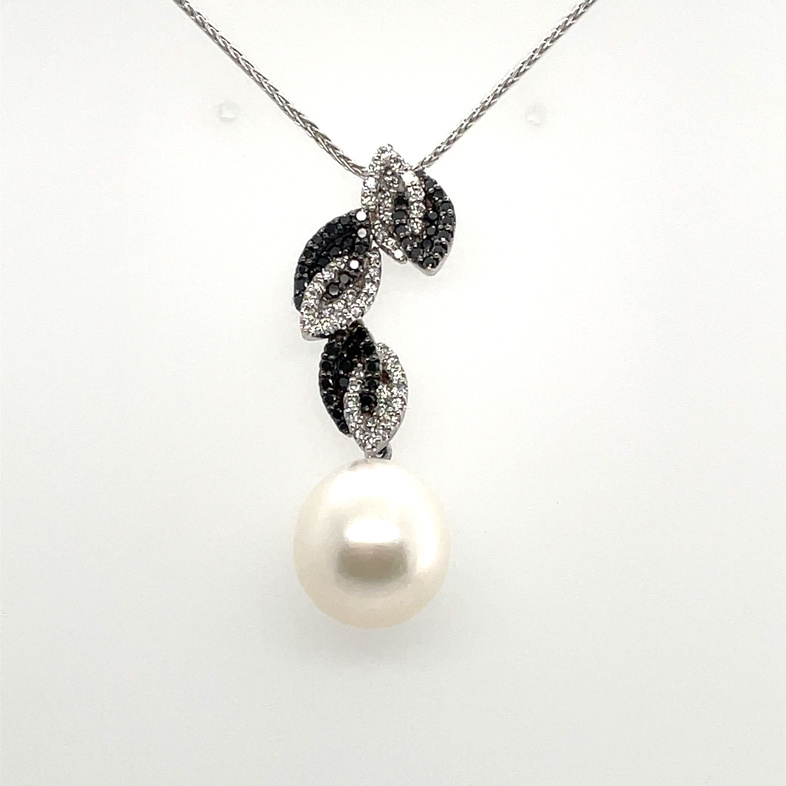 YVEL .93TDW 12X14MM FRESHWATER CULTURED PEARL DROP PENDANT NECKLACE WITH BLACK & WHITE LEAVES CONTAINING: 46 ROUND BLACK DIAMONDS; .465TDW; + 47 ROUND DIAMONDS; .465TDW; 18KW CHAIN INCLUDED