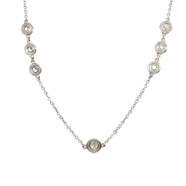 DIAMONDS BY THE YARD 18 TRIPLE STATIONS NECKLACE CONTAINING: 15 ROUND DIAMONDS; .69CTW; 14KW