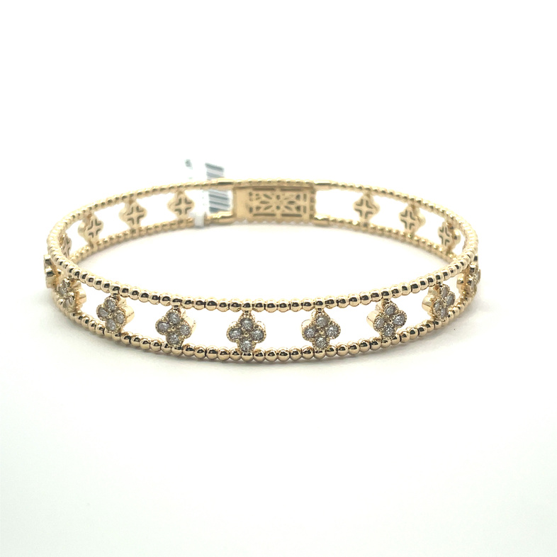 .78CTW DIAMOND MULTI-QUATREFOIL STATIONS FLEX BANGLE BRACELET CONTAINING: 36 ROUND DIAMONDS; I; SI1; 14KY