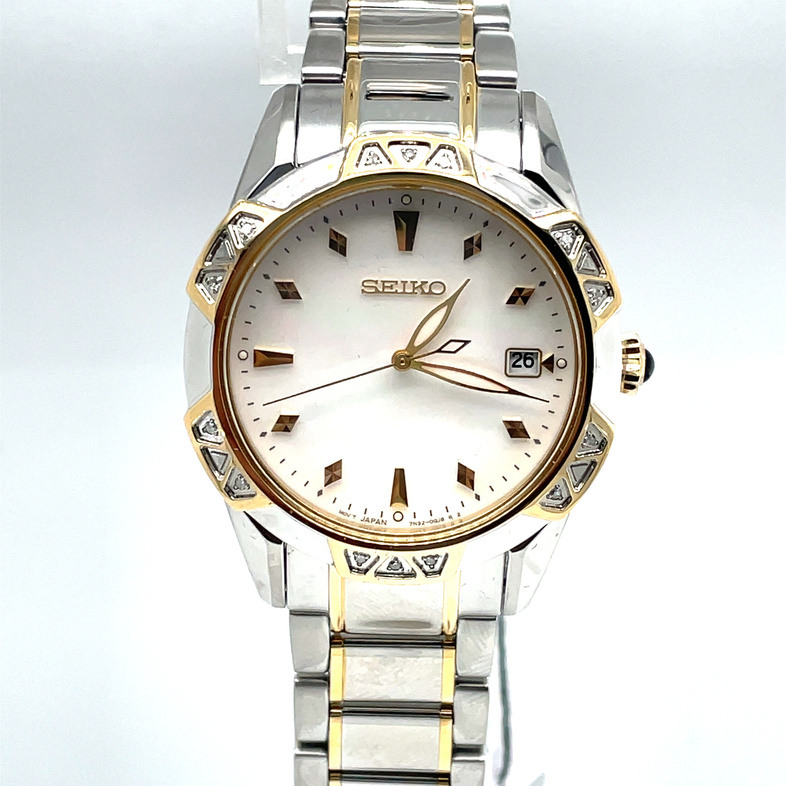 SEIKO 33.2MM ROUND WHITE MOTHER OF PEARL DATE DIAL WATCH; 14 ROUND DIAMOND BEZEL; LINK BRACELET; STAINLESS/GOLD TONE