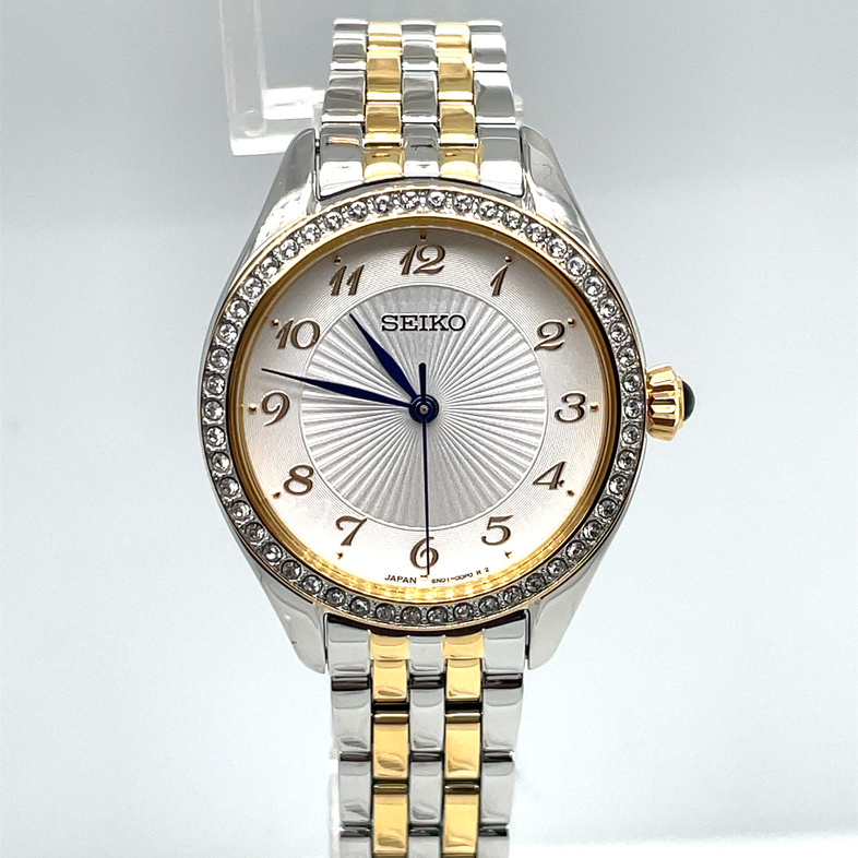 SEIKO 29MM ROUND WHITE PATTERNED ARABIC NUMERAL DIAL WATCH; CRYSTAL BEZEL; 5-ROW LINK BRACELET; STAINLESS/GOLD TONE